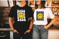 two people standing next to each other wearing t shirts with the words baa baa baa on them