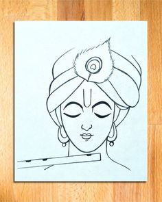 a drawing of a woman's face with eyes closed and her hair in a turban