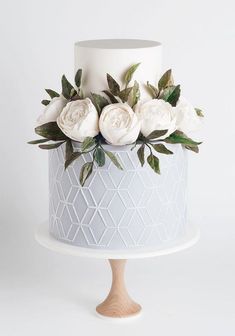 there is a white cake with flowers on it