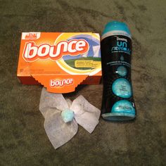 an unopened bottle of bounce next to a bow tie and toothpaste