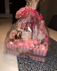 a bag filled with lots of pink items on top of a table