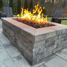 a fire pit sitting on top of a stone patio