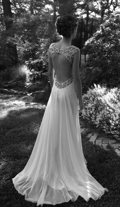 the back of a woman's dress in black and white