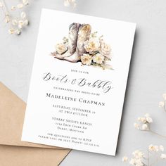 a wedding card with boots and flowers on it