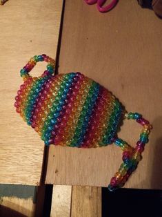 A typical face mask that is made entirely out of Kandi beads.  (If worn out, please wear a regular cloth mask underneath for safety) Kandi Mask Patterns, Rainbow Kandi, Kandi Mask, Kandi Beads, Diy Kandi Bracelets, Diy Kandi, Cloth Mask, Kandi Bracelets, A Typical