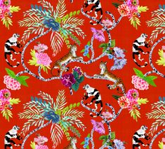 an animal and flowers pattern on red fabric