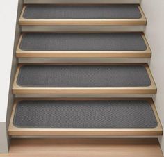 a set of stairs with carpet on the bottom