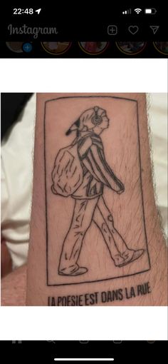 a man's arm with a drawing of a person holding a bag on it