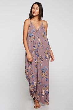 Are You Summer Ready? A beautiful and versatile sleeveless maxi dress in a floral print. Featuring adjustable spaghetti straps, an oversize cocoon fit, an embroidered trim v neckline, and side pockets. Great Resort Wear! Stay Sexy! Fabric: 100% Rayon Casual Floral Embroidered Maxi Dress For Beach, Floral Embroidered V-neck Maxi Dress For Brunch, Printed V-neck Maxi Dress For Daywear, Sleeveless Floral Embroidery Maxi Dress For Brunch, Bohemian V-neck Maxi Dress For Loungewear, Casual V-neck Maxi Dress With Floral Embroidery, V-neck Maxi Dress With Floral Embroidery For Vacation, Casual Maxi Dress With Floral Embroidery, Casual Floral Embroidered Maxi Dress