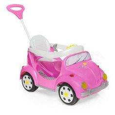 a pink toy car with a steering wheel