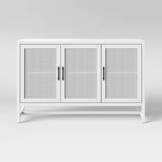 a white cabinet with three doors and two shelves