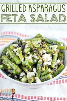 grilled asparagus with feta salad in a white bowl on a table