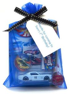 a blue bag filled with toys and a tag