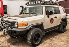 an off - road vehicle parked in front of a building