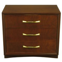 a wooden dresser with three drawers and gold handles