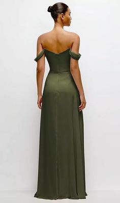 a woman in a green dress looking back