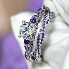 an engagement ring with purple and white stones