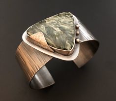 Handmade sterling silver cuff bracelet with a large septarian gemstone. Modernist Cuff Jewelry For Gift, Unique Hand Forged Cuff Bracelet For Formal Occasions, Unique Hand Forged Cuff Bracelet For Formal Events, Unique Polished Cuff Jewelry, Modern Gemstone Cuff Bracelet For Formal Occasions, Modernist Cuff Jewelry With Polished Finish, Modernist Polished Cuff Jewelry, Unique Polished Cuff Bracelet As Gift, Unique Polished Cuff Bracelet Gift