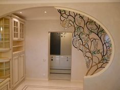 an entry way with a tree painted on the wall