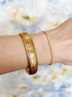 When you go gold, you go bold! Allow yourself to be fully seen in this turn of the century 14k gold-filled bangle bracelet with unique designs! “I LOVE IT WITH MY WHOLE HEART” GUARANTEE: In our jewelry, we use 14k gold filled, sterling silver, and solid brass as well as vintage components that have stood the test of time! These antique components are of high quality and have lasted for many decades - many even centuries! You can trust that if it still looks good today, it will stand the test of Luxury Heirloom Bracelets With Etched Details, Luxury Antique Gold Bracelet Engraved, Unique Bridal Jewelry, Big Statement Earrings, Glam Earrings, Costume Rings, Heirlooms Jewelry, Boho Glam, Jewelry Workshop