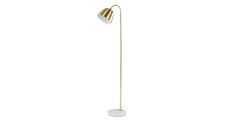 a gold and white floor lamp on a white background