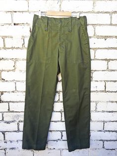 "Vintage Mens British Army Issue Work Trousers - Olive Green - Various Sizes - ADJUSTABLE Fantastic Grade A true vintage British military work pants in a mid-weight cotton blend. Tailored and flattering easy to wear design that makes them ideal for wearing day to day. We have these available in sizes 24\"-38\". Features - 1 buttoned back pocket - Wide belt loops - Zip and button fly - Waist adjusters at the side which tighten (so if unsure size up and bring in to fit) - Deep slashed side pockets Military Cotton Cargo Work Pants, Military Style Cotton Work Pants With Cargo Pockets, Full Length Military Cotton Cargo Pants, Military Style Cotton Work Pants With Side Pockets, Military Style Tapered Leg Cotton Cargo Pants, Military Style Cotton Cargo Pants With Tapered Leg, Full Length Military Cotton Bottoms, Military Style Cotton Pants With Welt Pockets, Military Style Wide Leg Cotton Work Pants