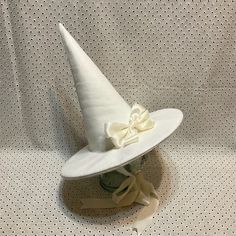 a white hat with a bow on it