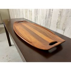 a wooden tray sitting on top of a table