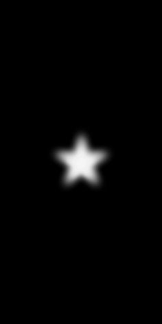 a black and white image of a star in the night sky with only one light visible