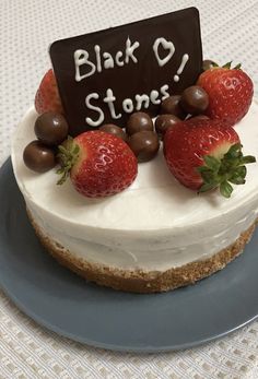 there is a cake with strawberries and chocolate on the top that says black o'stones