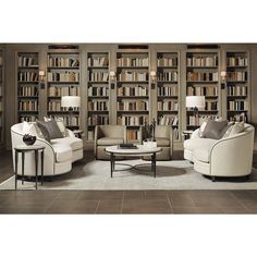 a living room filled with lots of furniture and bookshelves full of bookcases