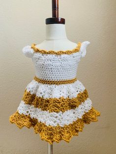 Crochet Baby Dress, Newborn - 6 months, 6months-12months, Crochet Baby Outfit, Baby summer Dress, Dress, Baby Gift, Gender reveal Dress. This baby dress can be used as a gender reveal, baby summer dress, for baby pictures, spring dress, and any special occasion. Custom color available. Dresses are made to order please allow at least 3 days to make or sooner but during holidays expect longer wait time.   If you have any questions, please feel free to message me and I will try and answer asap. Materials: 100% Soft acrylic yarn White Plastic Button for back This Dress can be purchased in the color of your choice. Length of Dress 0-6 months Length 13.5 Inches from shoulder to bottom of dress. Chest 18 inches but stretches to 20 inches. 6-12 months Length 16.5 inches from shoulder to bottom of Baby Summer Dress, Gender Reveal Dress, Baby Summer Dresses, Dress For Baby, Moreno Valley, Baby Summer, Crochet Baby Clothes, Crochet Baby Dress, Dress Gold