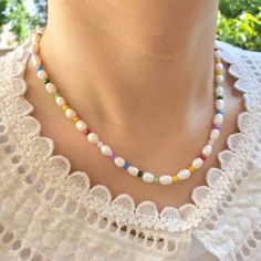 This freshwater Pearl beaded choker necklace is perfect addition to your summer outfit♥ These are so cute and trendy, Uniquely designed and handmade with Love. This necklace goes well with both casual and classy outfit so that you can wear everyday :) You can wear it as a statement necklace or layer with other jewelry as well. Options: Style A. Rainbow beads with Rice shape freshwater Pearls Style B. Rainbow beads with Potato shape freshwater Pearls Material: Fresh water Pearls, glass beads, see Trendy Pearl Necklace With Colorful Beads, Handmade Multicolor Pearl Necklace For Summer, Trendy Summer Pearl Necklace With Colorful Beads, Trendy Beaded Pearl Necklace For Summer, Trendy Summer Beaded Pearl Necklace, Summer Pearl Charm Beaded Necklace, Multicolor Pearl Necklace For Summer, Multicolor Pearl Summer Necklace, Summer Multicolor Pearl Necklace