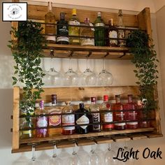 a wooden shelf filled with lots of bottles and glasses