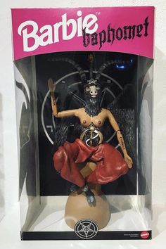 a doll in a box with an image of a demon on it