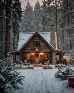 a cabin in the woods is lit up for christmas