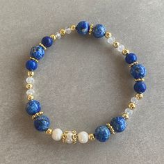 Lapis Lazuli Gemstone and White Pearl Bracelet Arrives ready for gifting and usually ships same day or next day. The necklace will be sent with a gift! O T H E R ∙ I N F O R M A T I O N Lapis Lazuli size: 8 mm Lapis Lazuli size: 6 mm Pearl size: 5-6 mm Crystal size: 3 mm **Intermediate apparatus and beads are non-tarnish gold plated. ☆ Each of our bracelets at PEARLOWNJEWELRY are handmade and special natural stones. Bracelet and necklace are made with positive energy. Each crystal is cleaned bef Blue Gemstone Beads Bangle Bracelet, Blue Bangle Bracelets With Gemstone Beads, Adjustable Lapis Lazuli Bracelet With Round Beads, Adjustable Blue Pearl Bracelet With Natural Stones, Adjustable Lapis Lazuli Beaded Bracelet With Faceted Beads, Hand-strung Lapis Lazuli Beaded Bracelets, Bohemian Lapis Lazuli Beaded Bracelets As Gift, Blue Spiritual Beaded Bangle Bracelets, Blue Gemstone Beads Bracelets As Gift