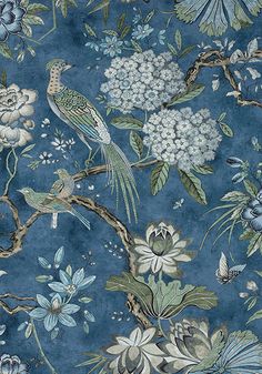 a blue floral wallpaper with birds and flowers