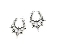 Add some gothic style to your wardrobe with these unique Chaos Earrings. Made in sterling silver, these earrings feature 5 spikes contrasted by a heavy textured crescent. Dimensions These earrings are 45mm long x 36mm wide and 5mm thick Each earring weighs approximately 6.5grams Thick Silver Jewelry, Edgy Silver Earrings For Festival, Punk Style Silver Jewelry With Silver Studs, Punk Style Silver Pierced Hoop Earrings, Edgy Silver Studs Jewelry, Edgy Silver Hoop Earrings, Silver Goth Earrings, Moodboard Jewelry, Gothic Oxidized Metal Earrings