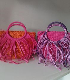 Crochet Raffia Top Handle Tote with Fringes - Colorful Tassel Tote Bag for Summer - Fringe Handbag - Hobo Bag with Boho Style - Wicker Beach Bag  Elevate your summer style with this vibrant crochet raffia top handle tote, adorned with playful fringes and colorful tassels. Perfect for beach days or casual outings, this hobo bag exudes boho charm with its blend of pink and orange hues. Ideal for carrying your essentials with flair, this handcrafted tote combines style and functionality effortlessl Multicolor Tassel Pouch Bag, Pink Beach Bag With Detachable Handle, Rectangular Pink Bag With Fringe, Pink Rectangular Tassel Bag, Pink Fringe Shoulder Bag, Pink Tassel Bag For Travel, Pink Bags With Tassels For Daily Use, Pink Fringe Bag For Daily Use, Red Beach Bag With Tassels