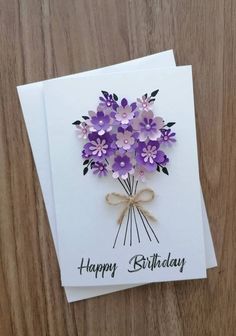 a birthday card with purple flowers on it