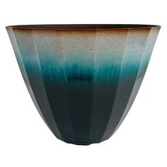 a black and blue vase sitting on top of a table