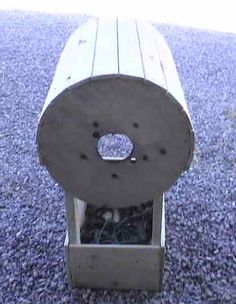 a wooden bench sitting on top of a blue carpeted floor next to a parking meter