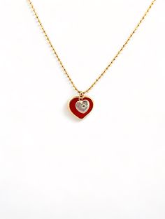 Give the special mom and daughter in your life an elegant and exclusive reminder of their bond with this gorgeous Mommy and Me Heart Necklace. Two delicate hearts, one in luxurious red and the other crafted from mother of pearl, hang from a dainty gold chain for a beautiful mother-daughter accessory. The perfect gift for an unforgettable bond. Luxury Red Necklace For Gift, Valentine's Day Heart Necklace Gift, Luxury Heart-shaped Necklace With Delicate Chain, Red Double Heart Necklace For Anniversary, Elegant Red Heart Pendant Necklace, Heart Necklace With Delicate Chain For Mother's Day, Elegant Gold Plated Charm Necklaces For Valentine's Day, Red Jewelry For Valentine's Day Gift, Red Open Heart Jewelry For Mother's Day