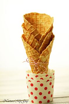 a stack of waffles sitting in a cup on top of a table