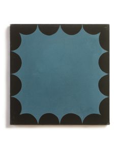 a black and blue tile with circles on it