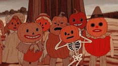 a group of cartoon pumpkins standing next to each other in front of a tree