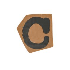 a piece of cardboard with the letter c on it's side and a black circle in the middle