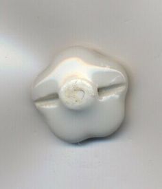 a white ceramic object sitting on top of a table