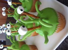 cupcakes decorated with green icing and googly eyes